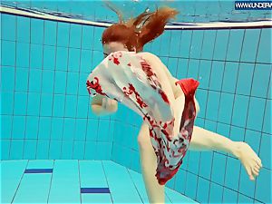 steaming polish redhead swimming in the pool